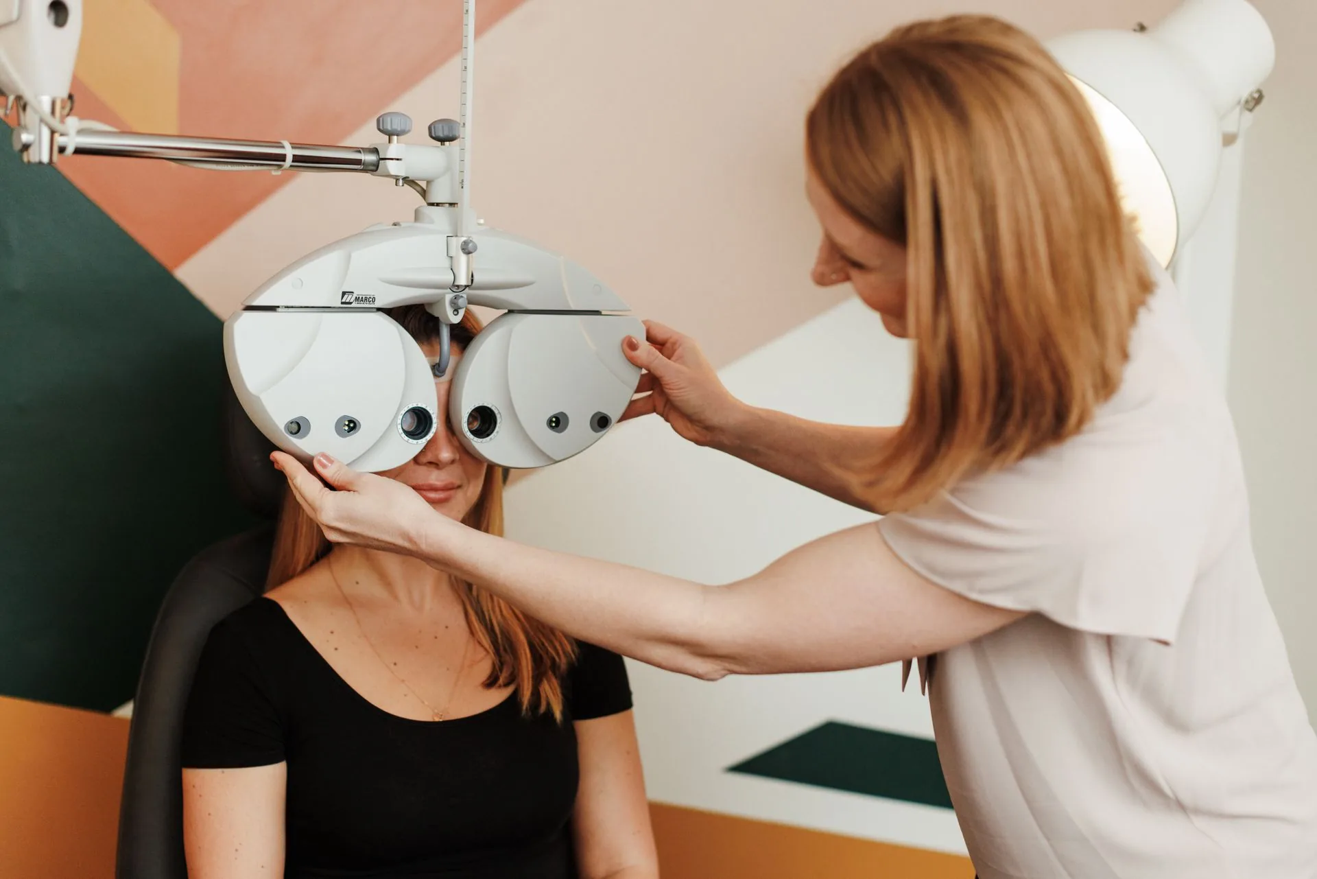 An optometrist examining a patient at The Vision Collective